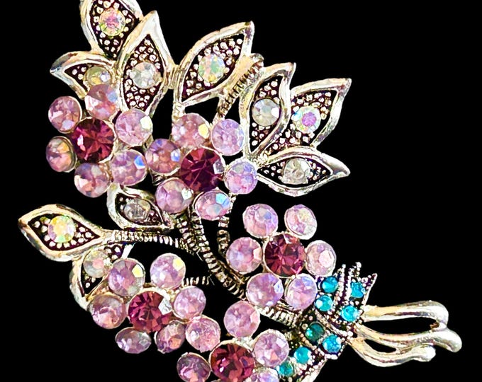 Featured listing image: Nina Ricci for Avon vintage 1970s sparkling rhinestone silvertone brooch