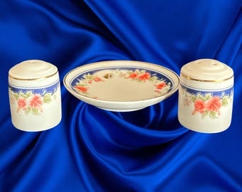 Malaysia Airlines First Class porcelain salt and pepper shakers with plate vintage 1980s