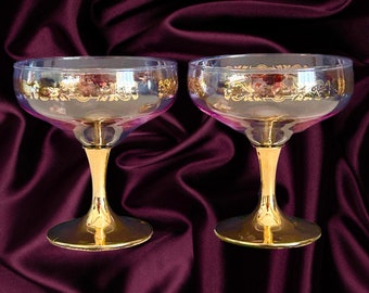 Vintage 1960s pair of pink washed glass and gold stem coupe champagne glasses