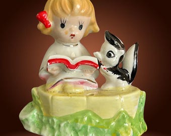 Vintage 1950s rare small Japanese kitsch porcelain figurine girl reading to skunk