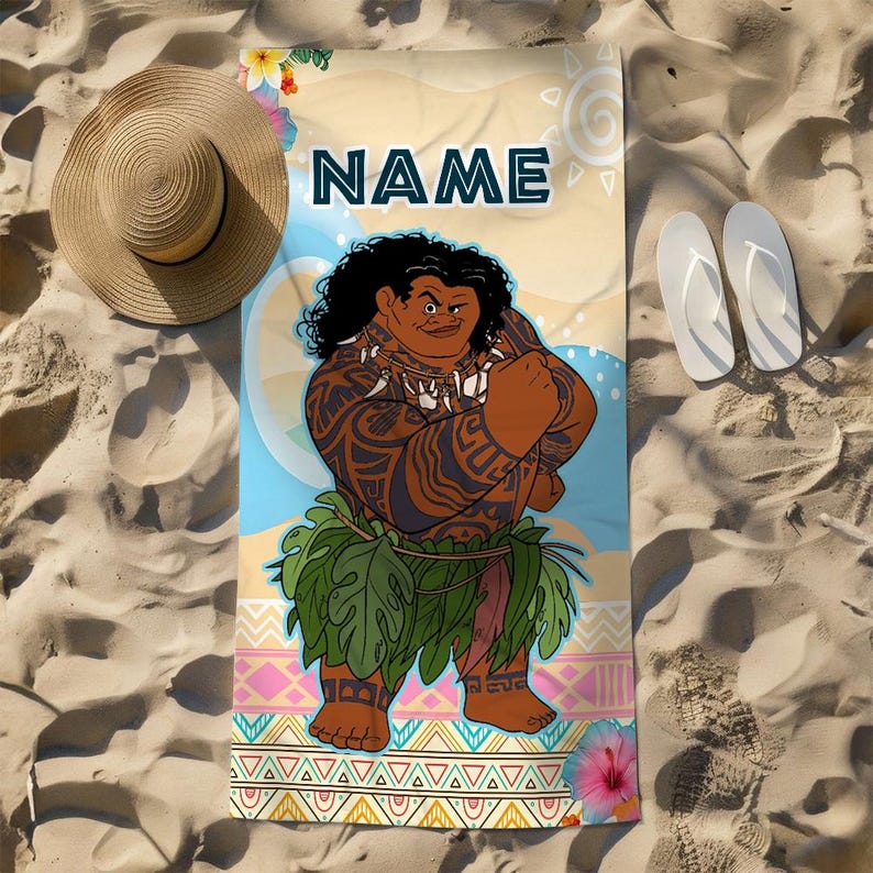May include: A rectangular beach towel featuring a graphic illustration of a muscular character with dark curly hair, tribal tattoos, and a green leaf skirt. The word NAME is printed in dark blue at the top, with colorful geometric patterns and flowers.