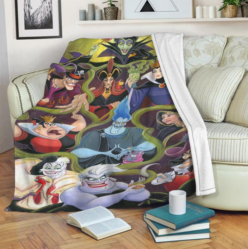May include: A colorful fleece blanket featuring Disney villains including Maleficent, Ursula, Cruella de Vil, and more. The blanket is printed with a dark background and green vines.