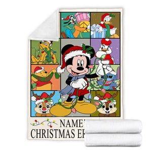 May include: A white fleece blanket featuring a colorful Christmas-themed design with Mickey Mouse and other Disney characters. The blanket has a grid pattern with each square showcasing a different character. The text "NAME' CHRISTMAS EF" is printed at the bottom.