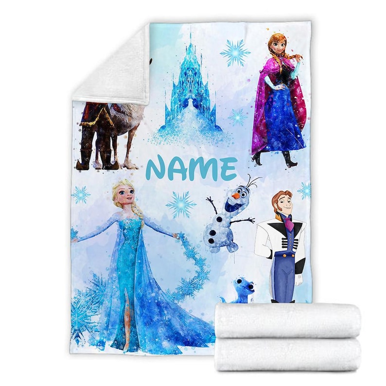 May include: A blue and white fleece blanket with a watercolor design featuring characters from the movie Frozen. The blanket features Elsa, Anna, Olaf, Kristoff, and Sven. The blanket also includes the text "NAME".