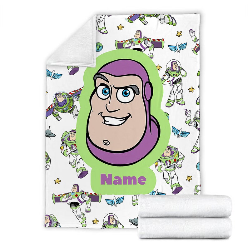 May include: A white fleece blanket featuring a repeating pattern of Buzz Lightyear in various poses, including flying and standing. A large, central lime green oval contains a close-up of Buzz Lightyear's face and the purple text Name.
