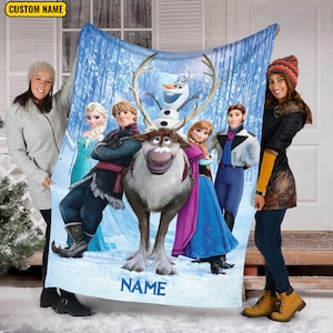 May include: A rectangular fleece blanket featuring a printed scene of Frozen characters including Elsa, Kristoff, Olaf, Sven, and Anna against a snowy forest background. The top left corner displays the text CUSTOM NAME and the bottom has NAME.