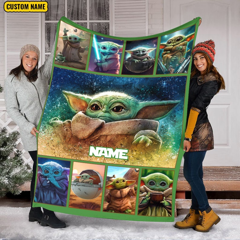 May include: A rectangular fleece blanket featuring a large central illustration of Grogu surrounded by eight smaller panels depicting the character in various scenes. The blanket has a green border and includes the text CUSTOM NAME and NAME.