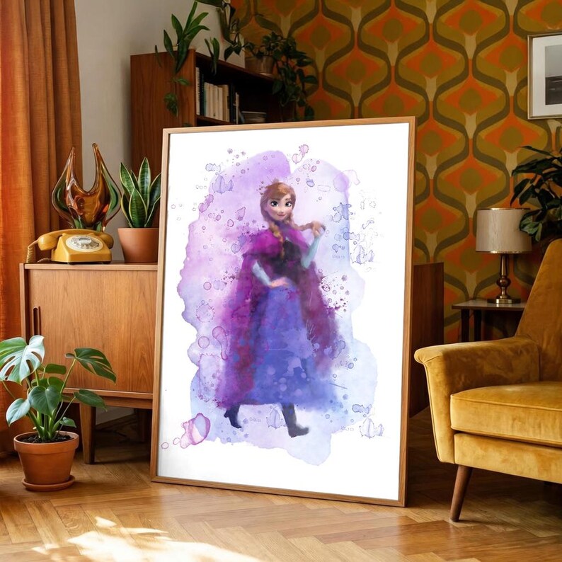 May include: Watercolor art print of a character in a purple dress and cape, set against a lavender and blue watercolor background. The artwork is framed in a light wood frame and is displayed in a room with mid-century modern decor.
