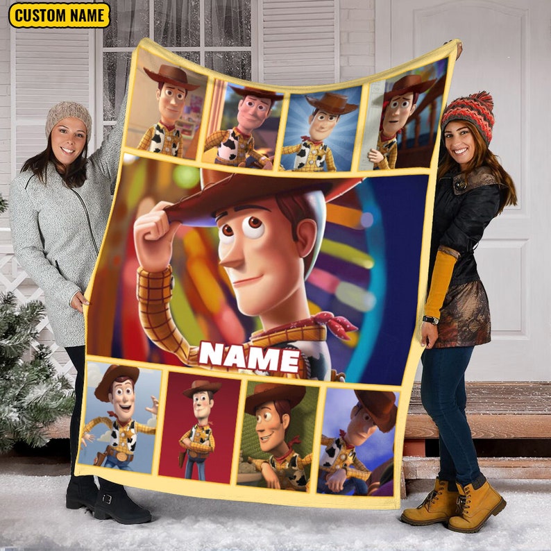 May include: A rectangular fleece blanket featuring multiple panels of the character Woody from Toy Story. The center panel shows a large image of Woody tipping his hat with the text NAME below. The border is yellow with a custom name label.