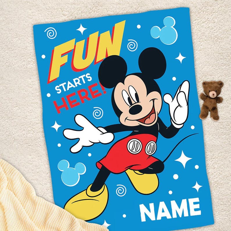May include: Blue and yellow personalized blanket featuring Mickey Mouse with the text "Fun Starts Here!" and a space for a name.