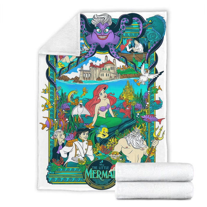 May include: A white fleece blanket featuring a colorful graphic print of The Little Mermaid characters including Ariel, Prince Eric, King Triton, and Ursula. The design includes an underwater scene with a castle, various sea creatures, and text.