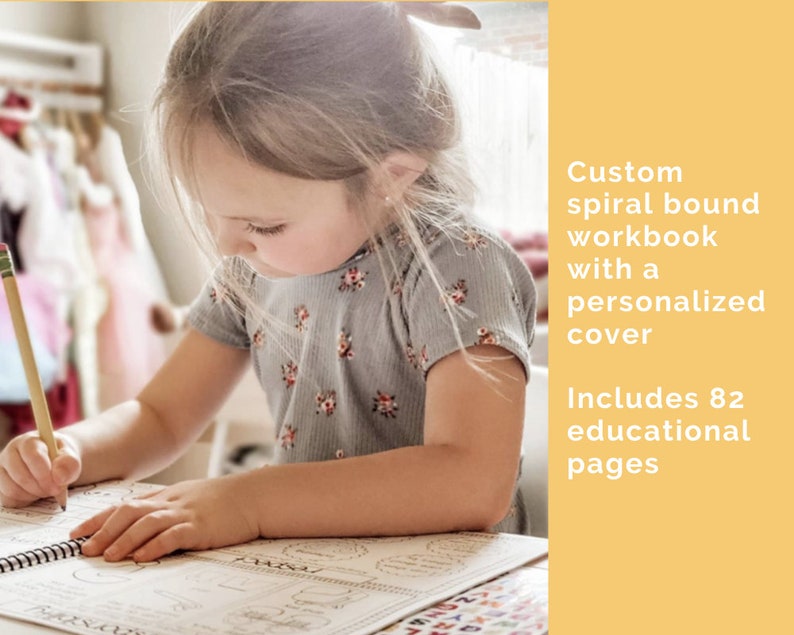 Young girl working on her workbook with words to the side that say custom spiral bound workbook with a personalized cover. Includes 82 educational pages.