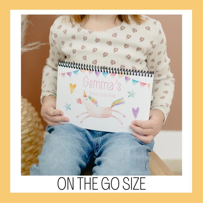 May include: A spiral-bound coloring book titled "Gemma's Unicorn Color Book" featuring a watercolor unicorn illustration with a rainbow mane and tail. The cover includes colorful hearts, stars, and pennants. The text "ON THE GO SIZE" is at the bottom.
