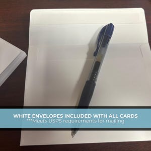 May include: A stack of white cards and an open white envelope with a black pen inside. The text on the image reads "WHITE ENVELOPES INCLUDED WITH ALL CARDS".