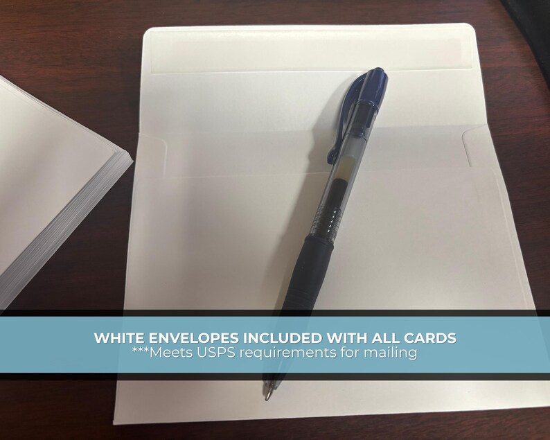 May include: A stack of white cards and an open white envelope with a black pen inside. The text on the image reads "WHITE ENVELOPES INCLUDED WITH ALL CARDS".