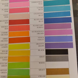 May include: Color swatches arranged in a grid, showcasing a variety of hues. The swatches include shades like Fireball Fuchsia, Gamma Green, and Solar Yellow. Each color is labeled with its name, providing a comprehensive color palette for design or reference.