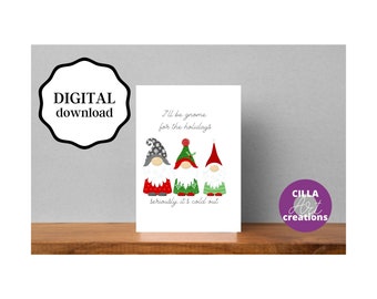 May include: A digital download print featuring three gnome illustrations with red, green, and gray hats. The text reads "I'll be gnome for the holidays, seriously it's cold out." The print includes the "CILLA Art creations" logo.