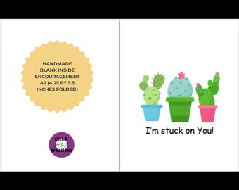 May include: A handmade blank encouragement card with a cactus theme. The card features three potted cacti in blue, green, and pink pots, with the phrase "I'm stuck on You!" The card is A2 size, 4.25 by 5.5 inches folded.