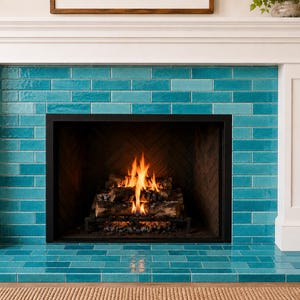 May include: A fireplace with a white mantel and turquoise tile surround. The fireplace has a black firebox with a burning fire and a hearth made of the same turquoise tile. A decorative item sits on the mantel.