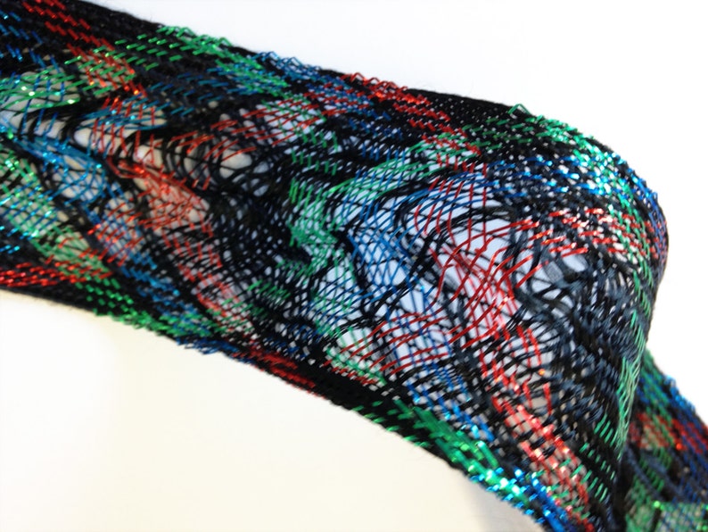 1 3-4th inches wide approx offering lots of 7 yds each. Red loose woven ribbon emerald green and bright blue lurex and black rayon