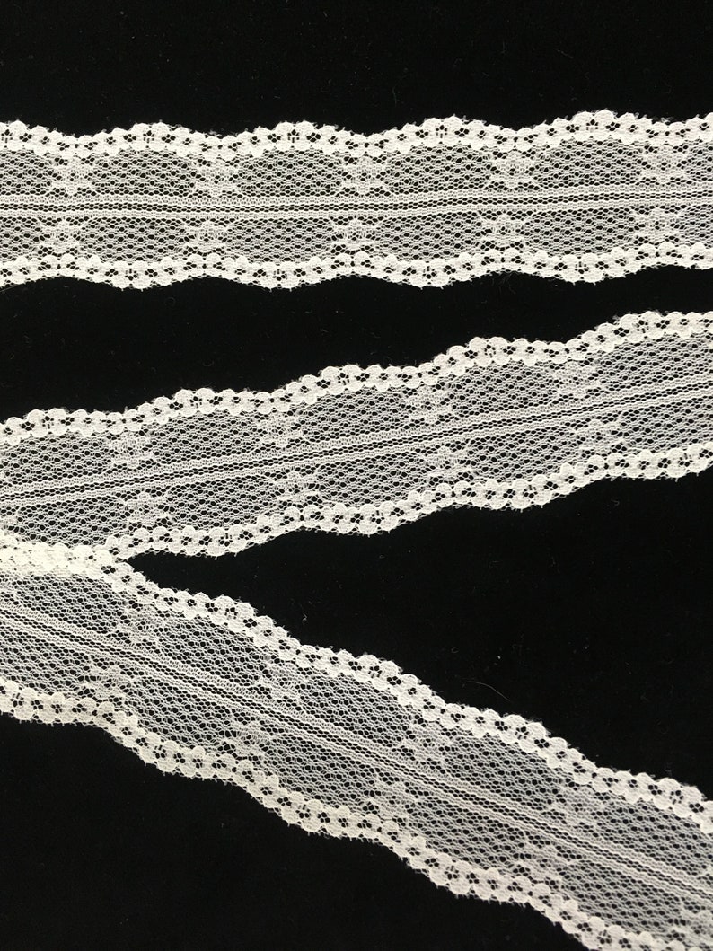 Lots of 21 yards. Off-white Chantilly Lace with a double wavy edge 1 12 wide