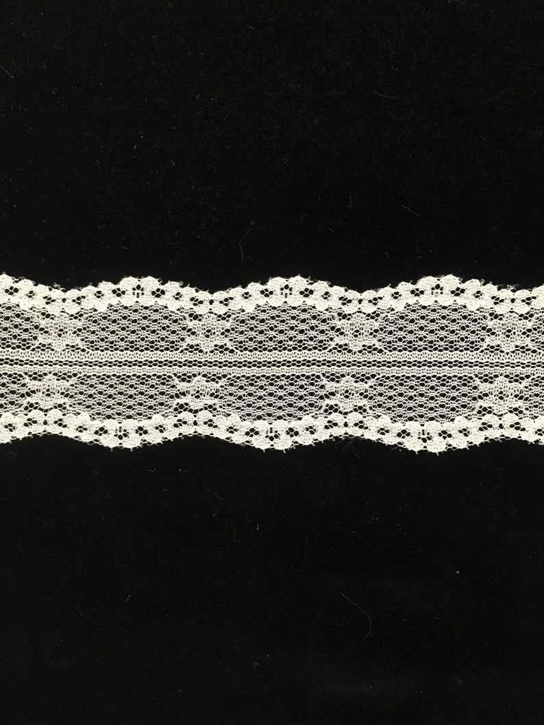 Lots of 21 yards. Off-white Chantilly Lace with a double wavy edge 1 12 wide