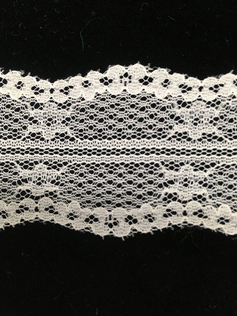 Lots of 21 yards. Off-white Chantilly Lace with a double wavy edge 1 12 wide