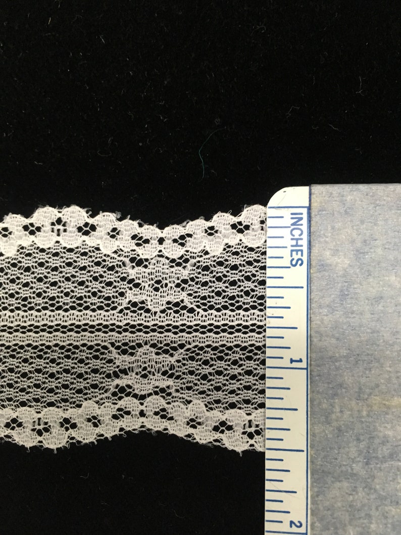 Lots of 21 yards. Off-white Chantilly Lace with a double wavy edge 1 12 wide