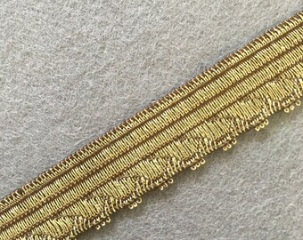 Antique Gold finely wrought lurex on cotton in either 5/16" or 9/16" widths. Lot sizes vary.