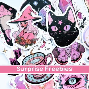 May include: A collection of colorful stickers with a witch, black cat, and butterfly designs. The stickers are in shades of pink, purple, and black. The text "Surprise Freebies" is displayed on a pink banner.