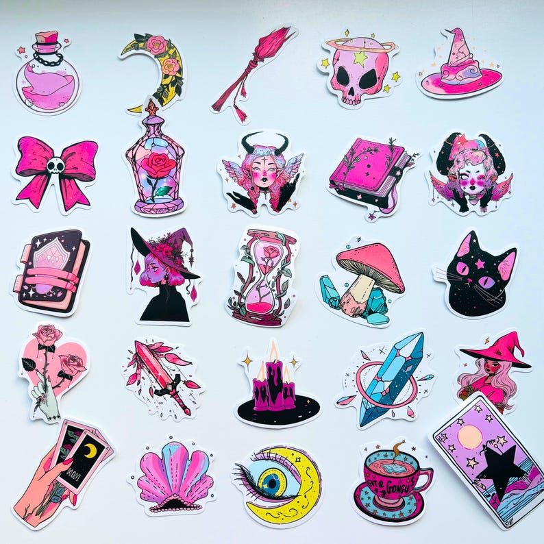 May include: A collection of colorful, whimsical stickers featuring mystical and witchy themes. Designs include a pink skull with a halo, a witch's hat, a black cat, a mushroom, a tarot card, and a teacup with the word "Gongu".