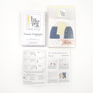 May include: A sewing pattern for a skirt called "Gonna Charlotte" by The Yellow Peg Patterns. The pattern includes instructions and diagrams for sewing the skirt. The pattern is for size XS.