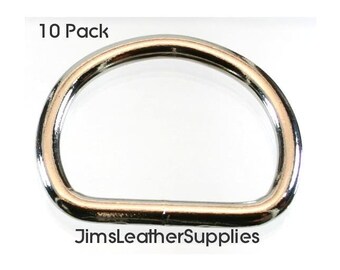 May include: A pack of 10 silver metal D-rings. The rings are smooth and shiny. The text "10 Pack" and "JimsLeatherSupplies" are visible in the image.