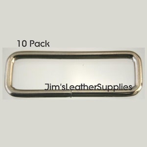 May include: A pack of 10 silver metal rectangular D-rings. The rings are about 1 inch long and 1/2 inch wide.  The rings are ideal for attaching to leather straps, belts, or other materials.