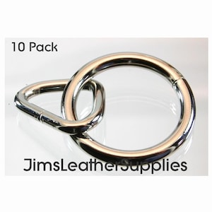 May include: A pack of 10 silver metal rings, each with a D-ring attached. The rings are interlocked, showing the D-ring on one ring going through the other ring.  The text "10 Pack" and "JimsLeatherSupplies" are visible in the image.