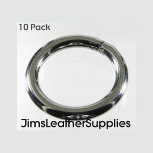 May include: A pack of 10 silver metal rings. The rings are smooth and round. 10 Pack.