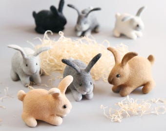 Handmade soft and cozy wool rabbits, created using the wet felting technique