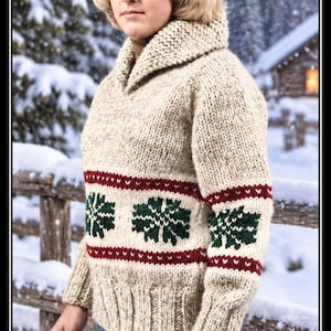 May include: A chunky knit jumper in oatmeal beige featuring a shawl collar, long sleeves, and a ribbed hem. The garment displays a horizontal band pattern with dark green snowflake motifs bordered by thin red stripes. Text reads WHITE BUFFALO Pattern 161.