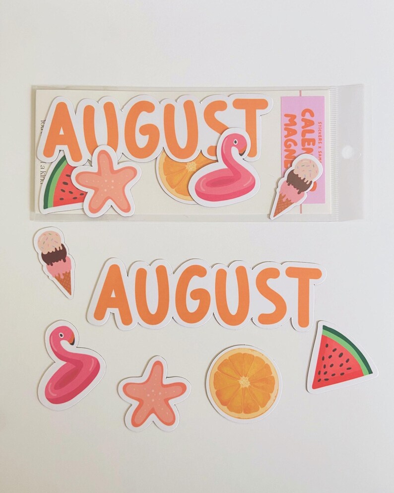May include: A set of summer-themed stickers and magnets featuring the word AUGUST in orange letters, a pink flamingo pool float, a peach starfish, a slice of watermelon, an orange slice, and a double-scoop ice cream cone on a white background.