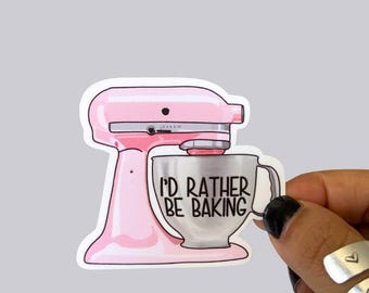 May include: A pink stand mixer with a silver bowl that says "I'd rather be baking".