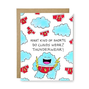 May include: A white greeting card featuring a pattern of light blue clouds and red underwear with yellow lightning bolts. The text reads: WHAT KIND OF SHORTS DO CLOUDS WEAR? THUNDERWEAR! A central cloud character wears red underwear with a yellow lightning bolt.