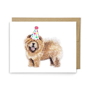 May include: A greeting card featuring a watercolor illustration of a fluffy tan Chow Chow dog wearing a white party hat with colorful polka dots. The dog has a dark muzzle, a visible tongue, and thick fur. A brown envelope is positioned behind the card.
