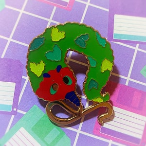 The Hungry Worm On A String Enamel Pin