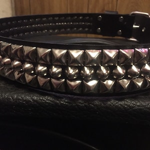 Three row pyramid and cone studded belt