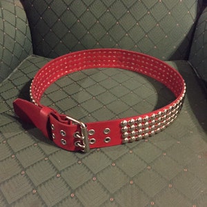 Red four row done studded leather belt