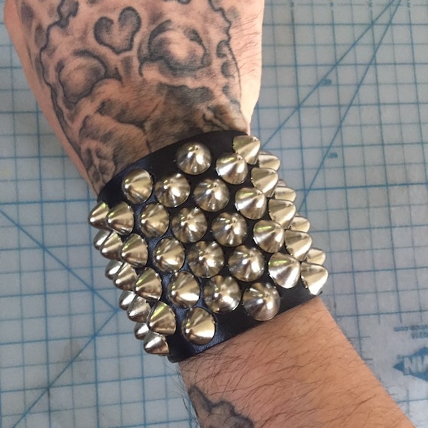 Five row staggered cone studded bracelet