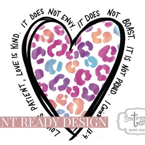 May include: A heart-shaped design with a leopard print pattern in shades of pink, purple, blue, and orange. The heart is outlined in black and surrounded by text that reads "Love is patient, love is kind. It does not envy. It does not boast. It is not proud. I Corinthians 13:4."