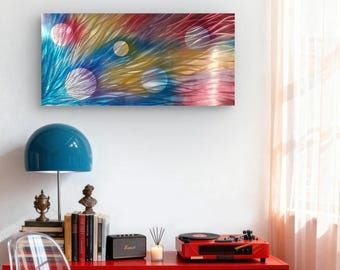 May include: Abstract metal wall art with a vibrant color palette of blue, red, yellow, and pink. The artwork features a textured design with circular accents, creating a dynamic and modern aesthetic. The piece is rectangular and mounted on a white wall.