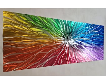 May include: Abstract metal wall art with a rainbow color scheme. The metal is textured and has a swirling pattern. The colors are vibrant and bright.