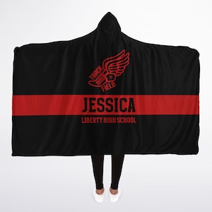 May include: Black hooded blanket with a red stripe and the text "Track and Field" with a running shoe graphic. The text "Jessica Liberty High School" is below the stripe.